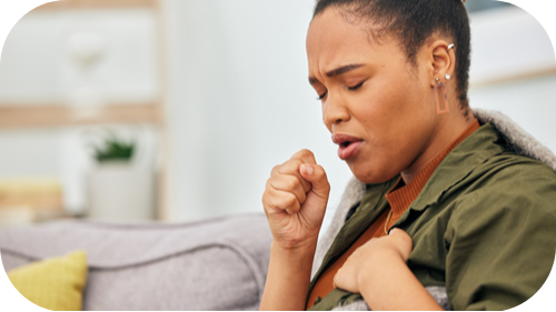 Female wincing and coughing.